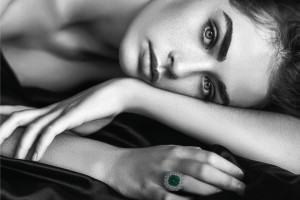 A girl with a green diamond ring