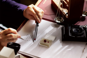 a gemologist examines a ruby